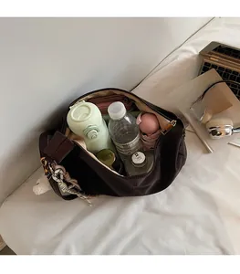 Spacious interior of dark brown hobo bag showing large capacity for daily essentials
