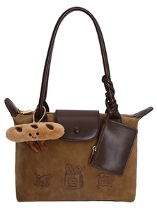 Brown suede tote bag with cartoon bread embroidery and cookie plush keychain accessory