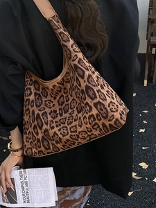 Chic vintage leopard print hobo shoulder bag styled for autumn street fashion