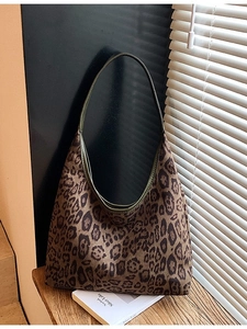 Retro leopard print hobo shoulder bag with dark green leather strap and crescent shape