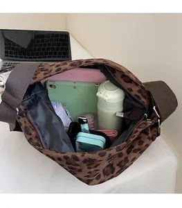 Interior view showing the spacious storage of the leopard print canvas tote bag