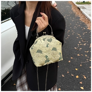 Detail of Chinese style crane embroidery on golden vintage silk crossbody bag