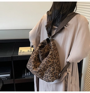 Detail shot of the spacious leopard print canvas tote bag with adjustable brown strap