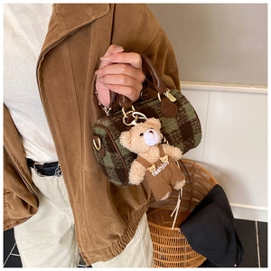 Detail of plaid wool mini Boston bag with a cute teddy bear charm on the handle