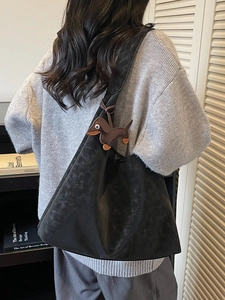 Minimalist black matte leather tote bag with brown dachshund pendant for women's commute