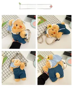 Detail view of a cute yellow plush bear bag with denim overalls and lace headscarf decoration