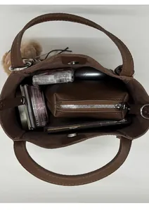 Top view of spacious brown litchi leather bucket bag showing interior storage capacity