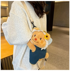 Cute teddy bear plush crossbody bag featuring denim overalls and a sunflower hat