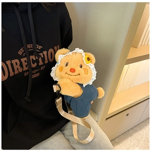 Side view of bear plush backpack with denim overalls and lace hat on a model