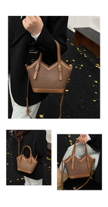 Close-up of brown woven tote bag with V-shaped cut and adjustable leather shoulder strap