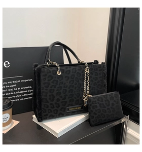 Detailed view of leopard print tote bag with faux fur trim and gold chain strap