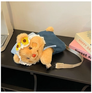 Detail of cute plush bear bag showing brown fur texture and blue denim overalls