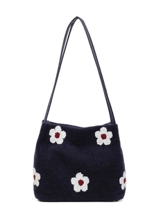Dark blue plush tote bag featuring five-petal floral embroidery and sleek shoulder straps
