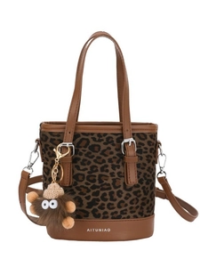 Fashionable leopard print bucket bag with brown leather straps and plush toy charm