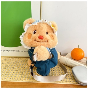 Detail of cute plush bear backpack featuring a blue denim outfit and lace floral sun hat