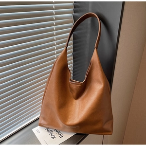 Detail of brown hobo bag showing soft textured PU leather and clean stitching work