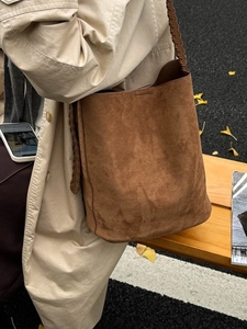 Retro deep brown suede bucket bag with woven leather strap for everyday commute