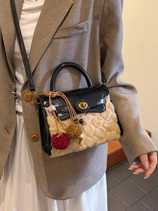 Lambswool crossbody bag with black patent leather top, heart patterns and fur ball charm