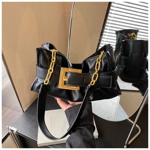 Detail of a chic black PU hobo bag featuring a gold buckle and thick metallic chain strap
