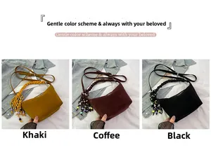 Close-up of matte suede bucket bags with woven handles and colorful beaded tassels
