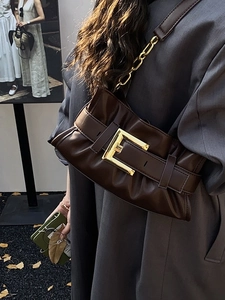 Chic dark brown leather shoulder bag with bold gold buckle and chain strap detail