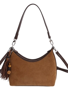 Vintage brown suede hobo bag with leather trim and decorative tassel charms
