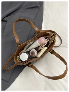 Top view of brown PU tote bag interior showing spacious lining and zipper pocket