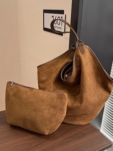 Brown faux suede tote bag set with matching pouch on a wooden table, stylish autumn style