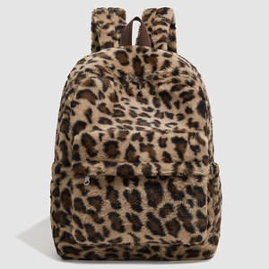 Close-up of fluffy leopard print plush backpack showing texture and zip details