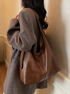 Minimalist large capacity dark brown crossbody tote bag in matte faux leather texture