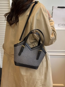Minimalist woven tote bag with V-cut design and black leather trim for women