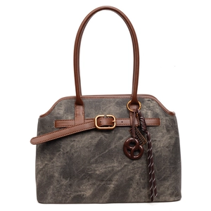 Retro-Handtasche aus grauem Segeltuch mit braunen Ledergriffen und Riemendetails