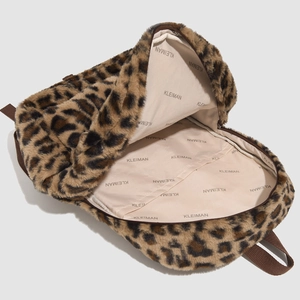 Interior view of leopard print plush backpack with brand lining and pocket