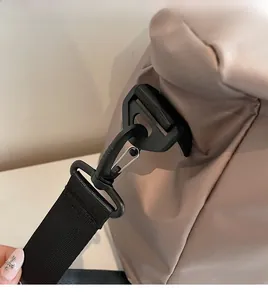 Close-up of durable rotating hook and nylon strap attachment on travel bag
