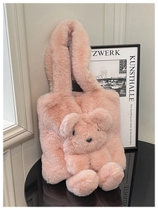 Close-up of fluffy pink faux fur tote bag featuring a cute 3D plush bear ornament