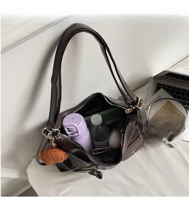 Spacious dark brown PU leather tote bag interior showing large storage capacity