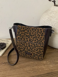 Fashionable leopard print bucket bag in dark brown leather with a No Filter logo label
