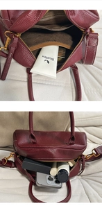 Interno spazioso della borsa Boston in pelle bordeaux che mostra la capacità per trucchi