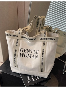Borsa tote minimalista in tela beige con scritte Gentlewoman nere e ampi spallacci spessi