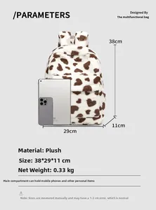Detailed view of white plush backpack with heart patterns showing dimensions 38x29x11cm