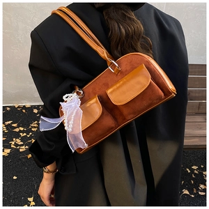 Brown vintage suede underarm bag with double front pockets and pearl lace charm detail
