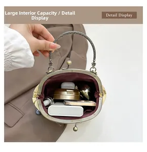 Detail view of vintage shell bag interior showing large capacity for phone and makeup