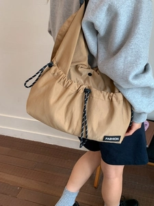 Light brown drawstring crossbody tote bag for women with large capacity and casual style