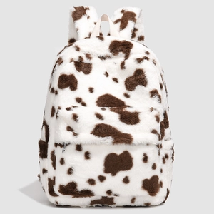 Detailed view of the soft cow print plush backpack with secure zipper and webbing straps
