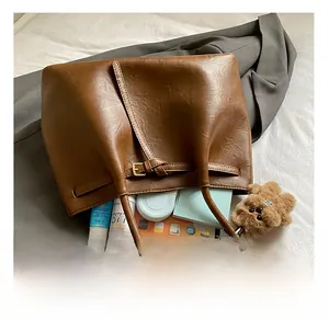 Macro shot of the large interior capacity of this vintage brown faux leather tote bag