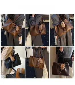 Multiple views showing the brown and black faux leather tote bags styled on a model