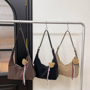 Hobo bags in coffee, black, and beige with cute bear charms and striped tassels