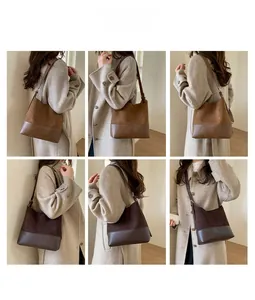 Detail shots of minimalist patchwork bucket bag in suede and smooth leather finishes