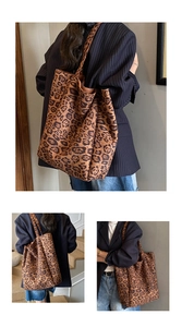 Detailed close-up showing leopard print suede texture and double straps of the tote bag