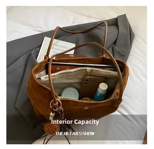 Large brown suede tote bag with spacious interior for laptop and daily essentials